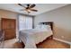The bedroom features a ceiling fan, window with curtains, and a dresser at 4860 Nara Vista Way # 204, Las Vegas, NV 89103