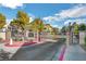 Gated community entrance with mature trees and a well-maintained landscape welcomes residents and guests at 4860 Nara Vista Way # 204, Las Vegas, NV 89103