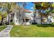 Beautiful building with lush green lawn, mature trees and manicured landscaping at 4860 Nara Vista Way # 204, Las Vegas, NV 89103