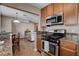 The kitchen features granite countertops and stainless steel appliances at 4860 Nara Vista Way # 204, Las Vegas, NV 89103