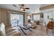 Inviting living room with neutral decor, sliding door to patio, and ceiling fan at 4860 Nara Vista Way # 204, Las Vegas, NV 89103