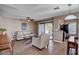 Cozy living room with neutral walls, access to balcony, and open to the kitchen at 4860 Nara Vista Way # 204, Las Vegas, NV 89103