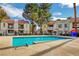 Community pool with clear blue water and ample space for relaxation, surrounded by lush landscaping at 4860 Nara Vista Way # 204, Las Vegas, NV 89103