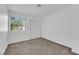 Neutral bedroom with carpet, a window and a closet with mirrored doors at 5029 Spencer St # D, Las Vegas, NV 89119