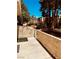Enclosed patio featuring block fence with white trim, concrete pavers, and partial shade at 5029 Spencer St # D, Las Vegas, NV 89119