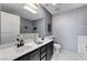 Spacious bathroom with double sinks, a large mirror, and ample counter space at 5171 Briar Patch Way, Las Vegas, NV 89118