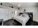 A bedroom with closet, ensuite bathroom, ceiling fan, and modern decor atop a polished concrete floor at 5171 Briar Patch Way, Las Vegas, NV 89118