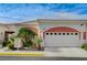 Charming single-story home featuring a two-car garage, landscaped front yard and desert landscaping at 5171 Briar Patch Way, Las Vegas, NV 89118