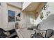 Cozy front porch with seating area, decorative elements, and a secure front entrance at 5171 Briar Patch Way, Las Vegas, NV 89118