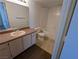 Bathroom featuring a combination tub and shower unit, single sink vanity and standard toilet at 555 E Silverado Ranch Blvd # 2147, Las Vegas, NV 89183