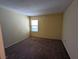 Spacious carpeted bedroom with a window and beige walls at 555 E Silverado Ranch Blvd # 2147, Las Vegas, NV 89183
