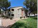 Two-story apartment building exterior with well-maintained landscaping and gravel accents at 555 E Silverado Ranch Blvd # 2147, Las Vegas, NV 89183