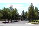 Gated community entrance with mature trees and manicured landscaping adding to the property's curb appeal at 555 E Silverado Ranch Blvd # 2147, Las Vegas, NV 89183