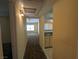 Hallway view leading to a living room with a ceiling fan and natural light at 555 E Silverado Ranch Blvd # 2147, Las Vegas, NV 89183