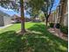 Lush green lawn and mature trees surrounding the apartments add to the community's beauty at 555 E Silverado Ranch Blvd # 2147, Las Vegas, NV 89183