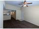 The living room features neutral walls, brown carpet, and a view into the kitchen area at 555 E Silverado Ranch Blvd # 2147, Las Vegas, NV 89183