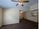 Neutral living room featuring a ceiling fan and opening to a kitchen bar area at 555 E Silverado Ranch Blvd # 2147, Las Vegas, NV 89183