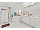 Bright bathroom featuring dual sinks, shower with glass door, and soaking tub at 6141 Markleham Ave, Las Vegas, NV 89130