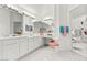Bright bathroom featuring dual sinks, ample counter space, and vanity area at 6141 Markleham Ave, Las Vegas, NV 89130