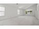 Bright primary bedroom with high ceilings and multiple windows for ample natural light at 6141 Markleham Ave, Las Vegas, NV 89130