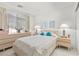 Bright bedroom with a large window, a dresser, and a bed with decorative pillows at 6141 Markleham Ave, Las Vegas, NV 89130