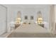 Bedroom featuring a queen bed, matching mirrors, lamps, and side tables at 6141 Markleham Ave, Las Vegas, NV 89130