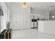 Bright dining area with large window, tile flooring, and white design elements at 6141 Markleham Ave, Las Vegas, NV 89130