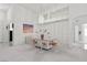 Bright dining room features a modern table and sleek chandelier for ambience at 6141 Markleham Ave, Las Vegas, NV 89130