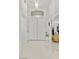 Bright foyer featuring sleek tile flooring, high ceilings, double doors, and an elegant light fixture at 6141 Markleham Ave, Las Vegas, NV 89130