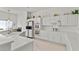 Bright kitchen featuring white cabinetry, a built-in oven, and sleek countertops, creating a clean and modern culinary space at 6141 Markleham Ave, Las Vegas, NV 89130