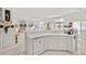 Kitchen featuring white cabinetry and countertops, overlooking the living spaces at 6141 Markleham Ave, Las Vegas, NV 89130