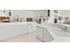 Bright kitchen featuring white cabinets, countertop, and stainless steel appliances at 6141 Markleham Ave, Las Vegas, NV 89130