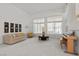 Bright living room offers large windows, comfortable sofa, and piano at 6141 Markleham Ave, Las Vegas, NV 89130