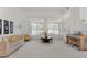 Bright living room with large windows, comfortable sofa, and stylish decor at 6141 Markleham Ave, Las Vegas, NV 89130