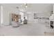 Open living space with fireplace, neutral furniture, and seamless flow at 6141 Markleham Ave, Las Vegas, NV 89130