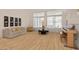 A virtual staged living room features a sofa, piano, and windows, creating a comfortable and inviting atmosphere at 6141 Markleham Ave, Las Vegas, NV 89130