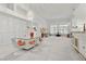 An expansive living area with lots of natural light, modern light fixture, and open space for versatile living at 6141 Markleham Ave, Las Vegas, NV 89130