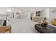Expansive living room featuring ample natural light, a cozy couch, and dining area at 6141 Markleham Ave, Las Vegas, NV 89130