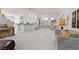Open-concept living area with kitchen, dining space, and comfortable seating arrangement at 6141 Markleham Ave, Las Vegas, NV 89130