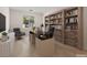 Bright, functional office space featuring wood-like floors and bookshelves at 6141 Markleham Ave, Las Vegas, NV 89130