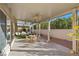 Picturesque covered patio with a ceiling fan and outdoor dining area at 6141 Markleham Ave, Las Vegas, NV 89130