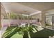 Spacious covered patio with outdoor seating area and serene desert landscaping at 6141 Markleham Ave, Las Vegas, NV 89130