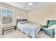 Cozy bedroom with natural light and minimalist decor, a tranquil retreat at 7115 Hickory Post Ave, Las Vegas, NV 89179