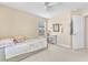 Cozy bedroom with a patterned bedspread, natural light from window, and a ceiling fan at 7115 Hickory Post Ave, Las Vegas, NV 89179