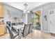 Dining area with access to outdoor patio, next to modern kitchen and dining area at 7115 Hickory Post Ave, Las Vegas, NV 89179