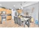 Dining area with glass table and modern chairs, complemented by stylish decor at 7115 Hickory Post Ave, Las Vegas, NV 89179
