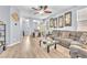 Spacious living room with stylish decor, ceiling fan, and plenty of natural light at 7115 Hickory Post Ave, Las Vegas, NV 89179