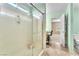 Modern shower with glass door and refreshing design with a view to primary bathroom at 7115 Hickory Post Ave, Las Vegas, NV 89179