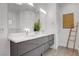 Elegant bathroom with a modern double vanity, stylish fixtures, and contemporary design at 7140 Palmyra Ave, Las Vegas, NV 89117
