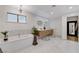 Modern bathroom featuring a soaking tub, double vanity, and a large walk-in closet with custom organizers at 7140 Palmyra Ave, Las Vegas, NV 89117